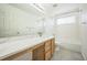 Bright bathroom with white tiled shower and marble countertop at 510 Fairhaven St, Castle Rock, CO 80104