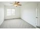 Bedroom with neutral carpet, closet, and large window at 510 Fairhaven St, Castle Rock, CO 80104