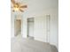 Bedroom featuring carpet, a sliding-door closet, and neutral walls at 510 Fairhaven St, Castle Rock, CO 80104