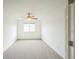 Neutral carpeted bedroom with a ceiling fan and natural light at 510 Fairhaven St, Castle Rock, CO 80104
