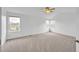 Neutral bedroom with a ceiling fan and multiple windows, showcasing a comfortable and bright space at 510 Fairhaven St, Castle Rock, CO 80104