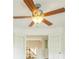 Close-up of a modern ceiling fan with wooden blades and overhead lighting at 510 Fairhaven St, Castle Rock, CO 80104