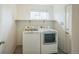 Well-lit laundry room with appliances and a storage shelf offering convenience and organization at 510 Fairhaven St, Castle Rock, CO 80104
