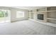 Spacious living room with a cozy fireplace and built-in shelving, perfect for gatherings and relaxation at 510 Fairhaven St, Castle Rock, CO 80104