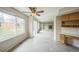 Bright room featuring large windows, ceiling fan, and fireplace perfect for relaxation and entertaining at 510 Fairhaven St, Castle Rock, CO 80104