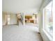 Open floor plan shows a living room leading into the kitchen with a staircase and large window at 510 Fairhaven St, Castle Rock, CO 80104