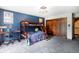 room with custom bunk beds, desk, and built-in closet featuring a fun vibrant vibe at 12570 W 60Th Ave, Arvada, CO 80004