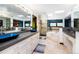 Bright bathroom with blue vessel sinks, soaking tub, glass shower, and dual vanity at 12570 W 60Th Ave, Arvada, CO 80004