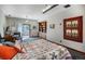 Bright bedroom with decorative quilt, built-in shelving, and access to an outdoor space at 12570 W 60Th Ave, Arvada, CO 80004