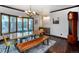 Bright dining room featuring a large window and a unique wooden table and bench set at 12570 W 60Th Ave, Arvada, CO 80004