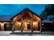 Inviting entryway with brick pillars and a wood ceiling at 12570 W 60Th Ave, Arvada, CO 80004