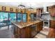 Gourmet kitchen with an oversized center island, stainless steel appliances, and granite countertops at 12570 W 60Th Ave, Arvada, CO 80004