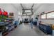 Spacious and well-lit garage with ample storage space and room for multiple vehicles and car lift at 12570 W 60Th Ave, Arvada, CO 80004