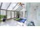 Bright sun room with vaulted ceiling and large windows, ideal for relaxation and exercise at 12570 W 60Th Ave, Arvada, CO 80004