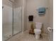 Modern bathroom features a walk in shower, tile floors, and neutral wall color at 1425 Blue Sky Cir # 15-107, Erie, CO 80516