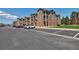 Exterior view of apartment complex with lush landscaping, convenient parking, and attractive architectural details at 1425 Blue Sky Cir # 15-107, Erie, CO 80516