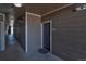 Neutral-toned hallway with outdoor access leading to unit 107 at 1425 Blue Sky Cir # 15-107, Erie, CO 80516