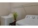 Bright laundry room features a modern washer and dryer plus convenient overhead storage at 1425 Blue Sky Cir # 15-107, Erie, CO 80516