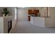 Comfortable living space featuring a fireplace, kitchen bar, and hardwood cabinets at 1425 Blue Sky Cir # 15-107, Erie, CO 80516