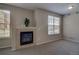 Cozy living room with a tiled fireplace, neutral carpet, and lots of natural light at 1425 Blue Sky Cir # 15-107, Erie, CO 80516