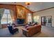 Cozy living room with a grand fireplace, complemented by large windows and comfortable seating arrangements at 1425 Blue Sky Cir # 15-107, Erie, CO 80516