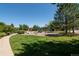 Community playground surrounded by lush green lawns, offering a safe and fun environment for children to play at 1425 Blue Sky Cir # 15-107, Erie, CO 80516