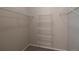 Walk-in closet has wire shelving and neutral carpet at 1425 Blue Sky Cir # 15-107, Erie, CO 80516