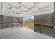 Back porch features picnic table, lattice, and wood floors at 8481 Clarkson St, Denver, CO 80229