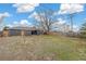 Large backyard featuring a patio, mature trees, a wooden fence, and nice landscaping at 8481 Clarkson St, Denver, CO 80229