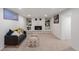 Finished basement features neutral carpet, recessed lighting, painted stone fireplace, and comfy seating at 8481 Clarkson St, Denver, CO 80229