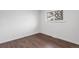 Empty bedroom with hardwood floors and a window providing natural light at 8481 Clarkson St, Denver, CO 80229