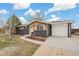 Well-maintained home with a two-car garage, walkway, and brick/stone accents at 8481 Clarkson St, Denver, CO 80229