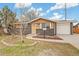 Charming single-story home featuring stone and brick accents, a well-maintained yard, and a single-car garage at 8481 Clarkson St, Denver, CO 80229