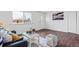 Cozy living room featuring modern furniture, hardwood floors, and a view of the outdoors at 8481 Clarkson St, Denver, CO 80229