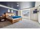 Primary bedroom with a feature wall, a modern bed frame and carpeted floors at 5352 Truckee St, Denver, CO 80249