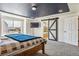Comfortable bedroom features a modern barn door leading to the ensuite and a large window at 5352 Truckee St, Denver, CO 80249