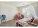 Charming bedroom with a white canopy bed and a view of the neighborhood at 5352 Truckee St, Denver, CO 80249