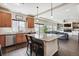 Open concept kitchen featuring granite countertops, a large island and stainless steel appliances at 5352 Truckee St, Denver, CO 80249