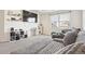 Relaxing living room with soft carpet, entertainment center, and a cozy sectional sofa at 5352 Truckee St, Denver, CO 80249