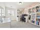 Bright office space featuring a large window and a custom bookcase at 5352 Truckee St, Denver, CO 80249