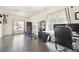 Bright office space featuring wood-look tile, bike rack, a white desk, and ample natural light at 5352 Truckee St, Denver, CO 80249