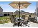 Cozy patio space with an umbrella-covered table and chairs, perfect for outdoor relaxation and dining at 5352 Truckee St, Denver, CO 80249
