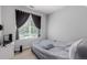 Bedroom features a window allowing natural light into the room, and neutral tones at 9185 Wilde Ln # 101, Parker, CO 80134