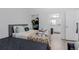 Bedroom features two beds, a closet, and an ensuite bath for added privacy and convenience at 9185 Wilde Ln # 101, Parker, CO 80134