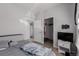 Bedroom featuring a window, hard surface flooring, and closet for convenience at 9185 Wilde Ln # 101, Parker, CO 80134