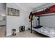 Bedroom view showcasing light grey walls, a bunk bed, and modern decor at 9185 Wilde Ln # 101, Parker, CO 80134
