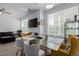 Cozy dining area with a stylish dining table, chairs, and a modern lighting fixture at 9185 Wilde Ln # 101, Parker, CO 80134