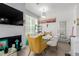Cozy dining area with a stylish dining table, chairs, and a modern lighting fixture at 9185 Wilde Ln # 101, Parker, CO 80134