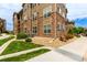 Attractive condo exterior with stone accents, multiple windows, and well-maintained landscaping at 9185 Wilde Ln # 101, Parker, CO 80134