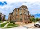 Attractive condo exterior with stone accents, multiple windows, and well-maintained landscaping at 9185 Wilde Ln # 101, Parker, CO 80134